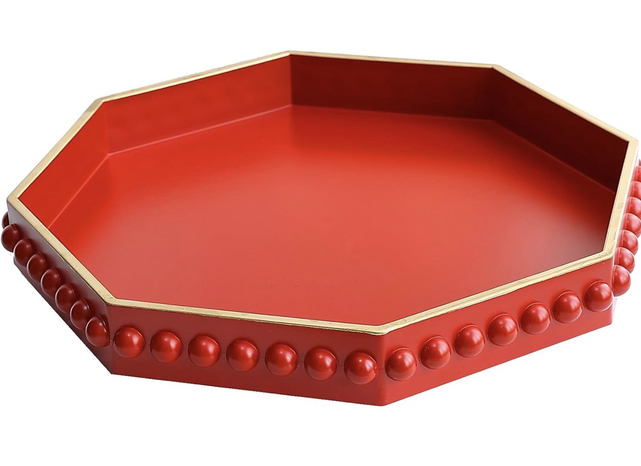Red decorative serving tray with gold trim.