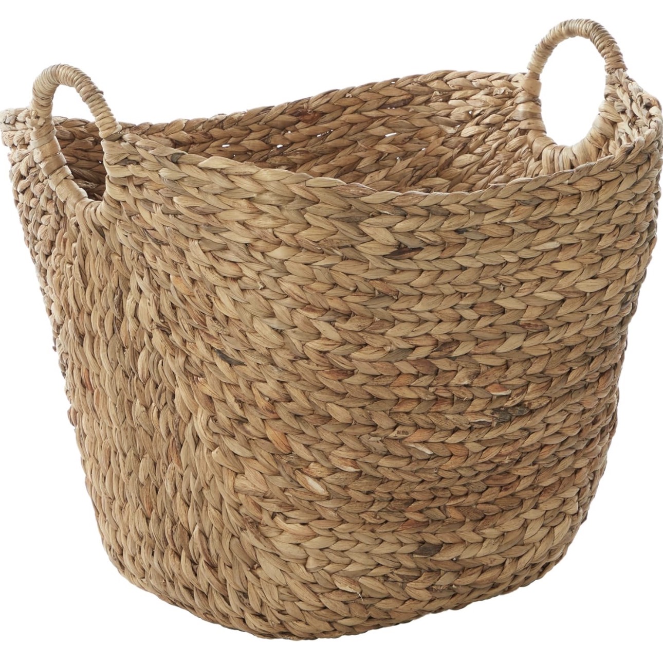 Large woven blanket basket with handles.