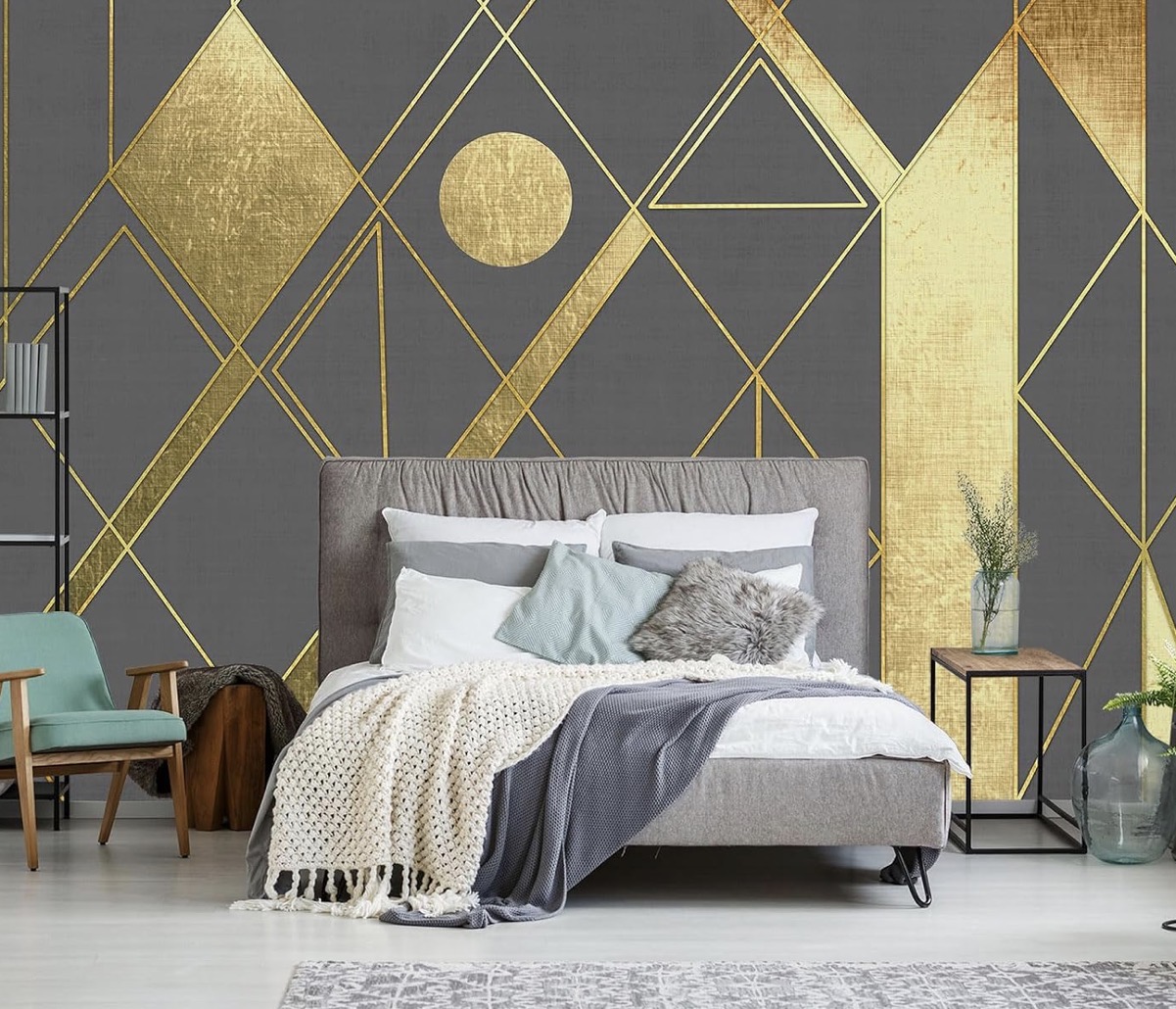 Gray and gold geometric wallpaper with a sophisticated metallic pattern.